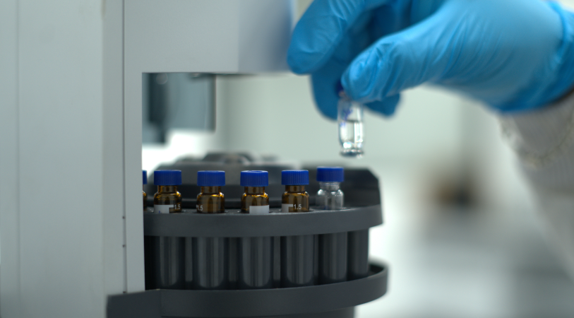 Laboratory experiment - scientist pouring liquid in lab